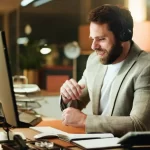 depositphotos_841416536-stock-photo-businessman-night-broker-headphones-office